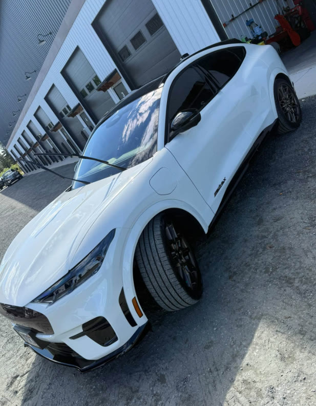 White Ford Mustang Mach-E GT with a deep gloss finish after detailing